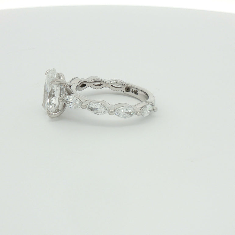 White Gold Multistone Ring with Oval Cut Diamond