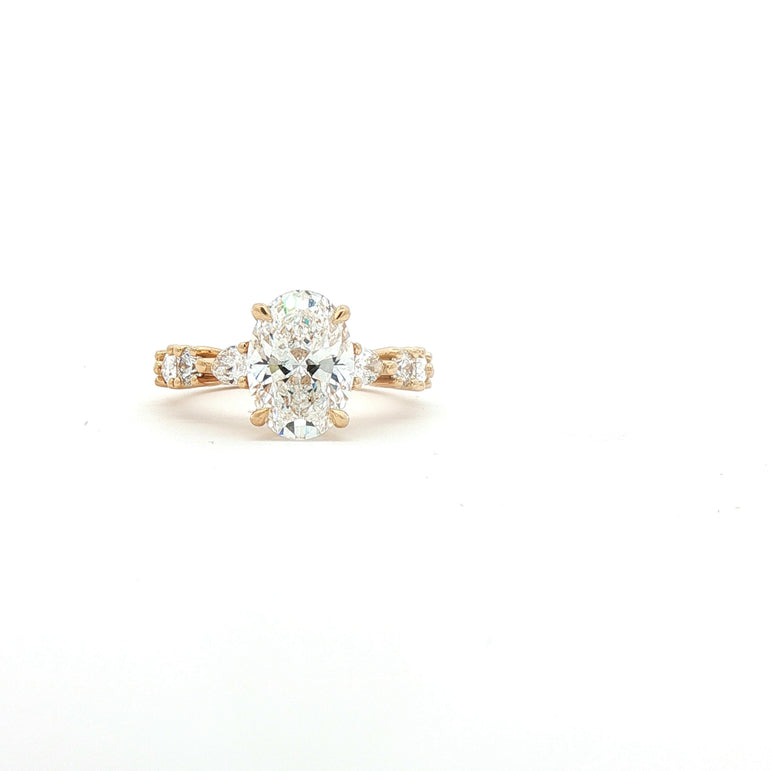Yellow Gold Multistone Ring with Oval Cut Diamond