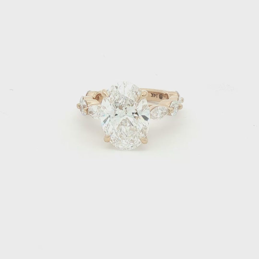 Rose Gold Multistone Ring with Oval Cut Diamond